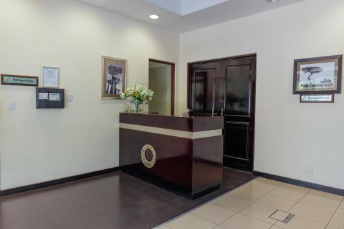 a room with a podium with flowers on the wall at Cresta Lodge Gaborone in Gaborone