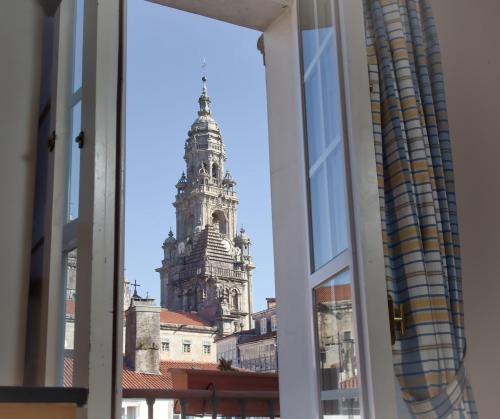 a view of a tall building from a window at Casa Celsa-Barbantes in Santiago de Compostela