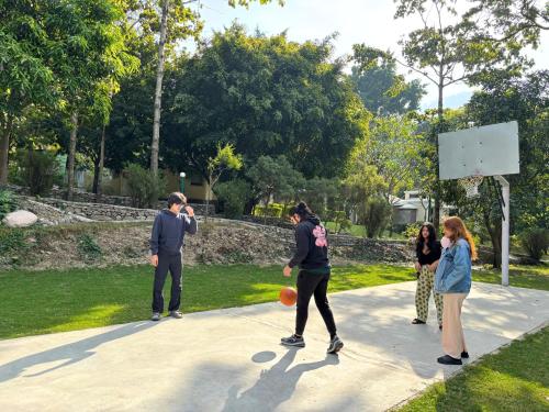 a group of people playing a game of basketball at The Solluna Resort in Marchula