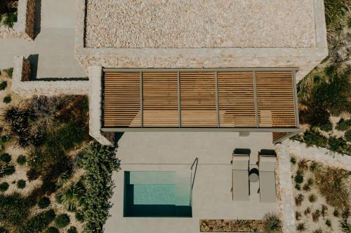 an overhead view of a house with a pool at Santorini Sky, Luxury Resort in Pirgos
