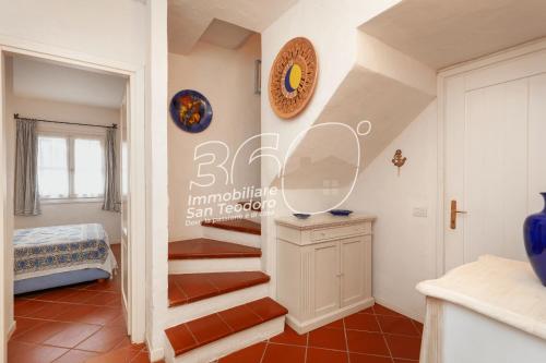 a room with a staircase in a house at Trilo Galathee g8 in Puntaldia