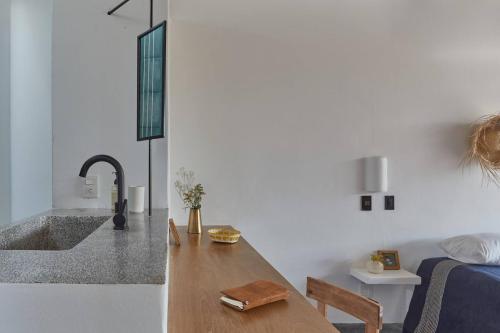 a kitchen with a sink and a counter top at Casa Ohma La Punta in Brisas de Zicatela