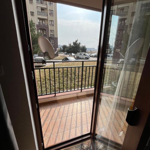 a view from a window of a balcony at Mika's Apartment in Tbilisi City