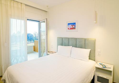 Ένα ή περισσότερα κρεβάτια σε δωμάτιο στο Eternal Suites Edessa