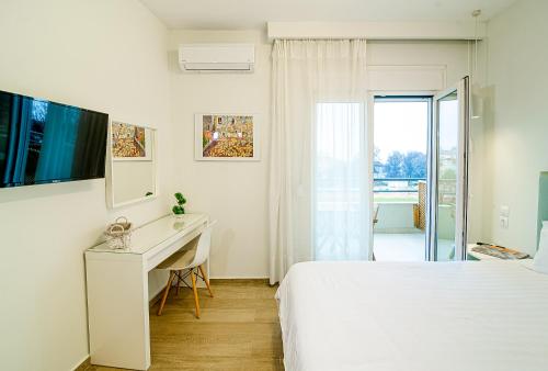 Ένα ή περισσότερα κρεβάτια σε δωμάτιο στο Eternal Suites Edessa