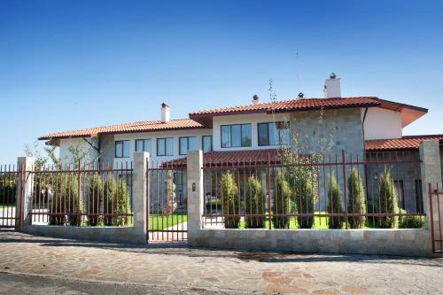 a house with a fence in front of it at Villa Trakia in Simeonovo