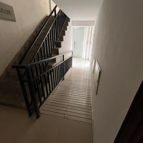 a staircase in a house with a stair case at Mika's Apartment in Tbilisi City