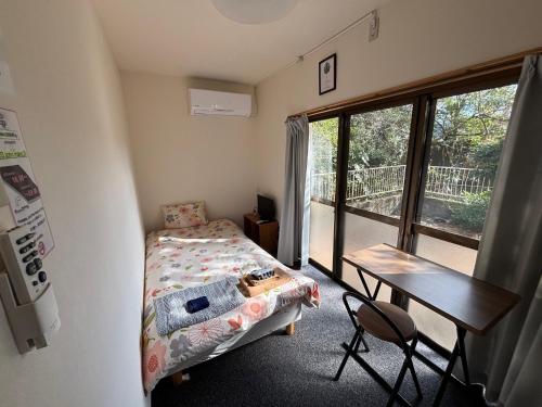 Postel nebo postele na pokoji v ubytování Hostel John Mang ゲストハウス ジョン