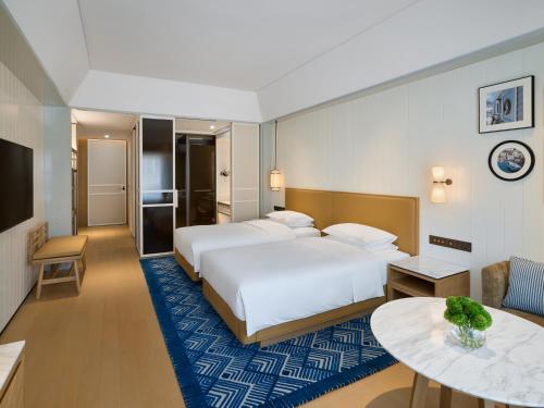 Ένα ή περισσότερα κρεβάτια σε δωμάτιο στο Hyatt Centric Ocean Front Xiamen