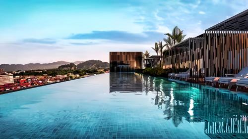 a swimming pool with a view of a city at The Horizon Ipoh in Ipoh
