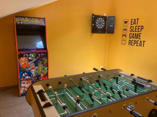 a play room with a pool table and a game apparatus at Gite Al'Pampa in Fosses-La-Ville