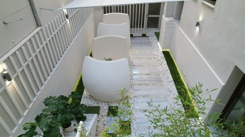 a balcony with a toilet on the floor of a building at CC LUX Suites in Piraeus