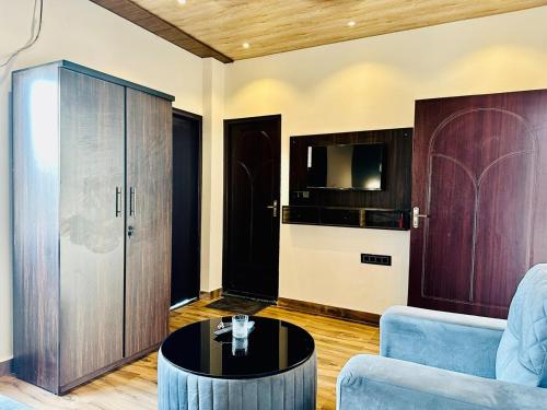 a living room with a couch and a table at The Luxe Villa by Vaaranya Group in Varanasi