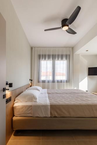 Ένα ή περισσότερα κρεβάτια σε δωμάτιο στο Dimi Residence