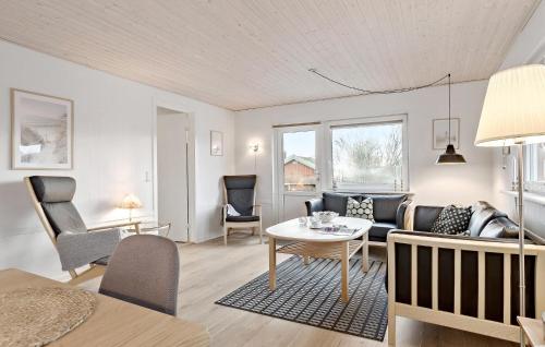 a living room with a couch and a table at Amazing Home In Haderslev With Wifi in Haderslev