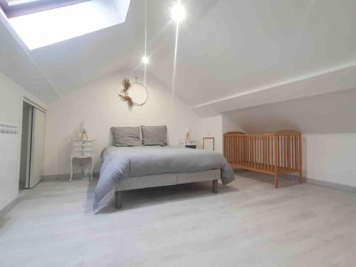 Ένα ή περισσότερα κρεβάτια σε δωμάτιο στο Le Petite Maison
