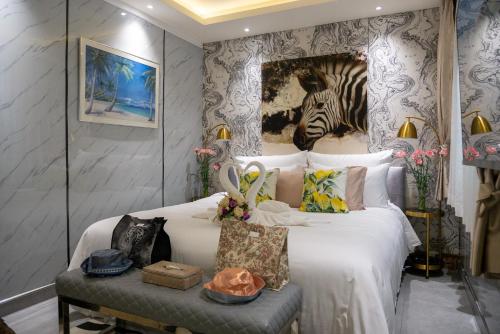 a bedroom with a bed with a zebra picture on the wall at 2 bedrooms Amani Pool Villa Phuket in Thalang