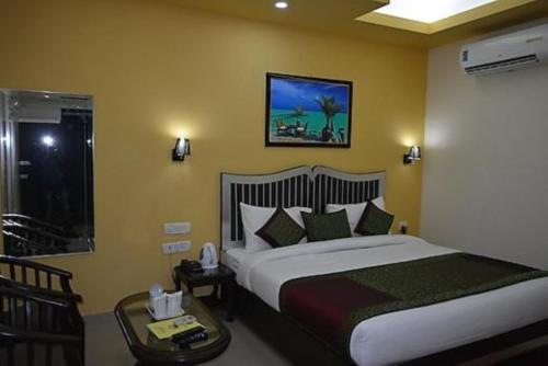 Un ou plusieurs lits dans un hébergement de l'établissement Jet Fox by Aero View Hotel, Delhi Airport