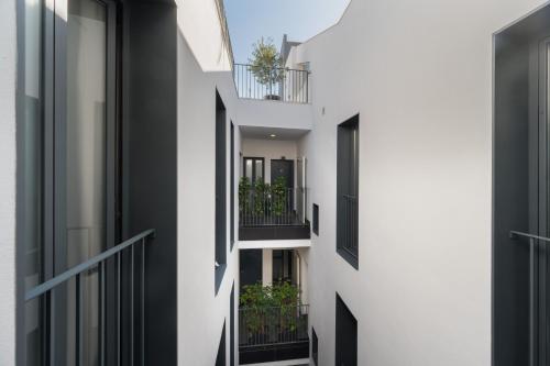 an external view of a building with balconies at Posada de los Venerables in Seville