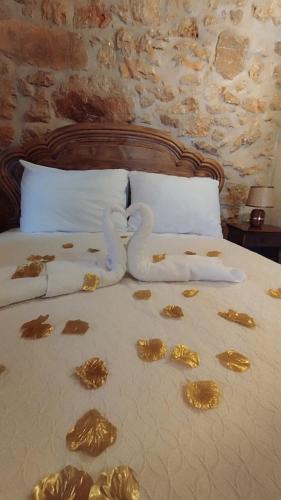 a bed with a bunch of food on it at Casa do casal POIOS in Pombal