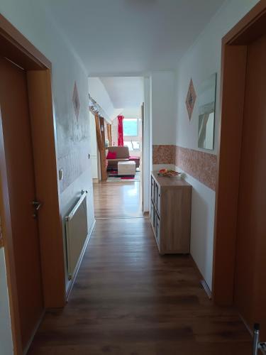 a hallway of a room with a kitchen and a living room at Ferienwohnung Schack in Bodensdorf