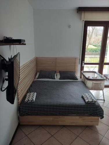 Katil atau katil-katil dalam bilik di Tennis & Swim Apartment