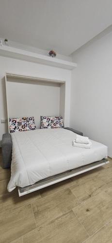 a bedroom with a large bed in a room at Dimora Margherita in Conversano