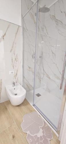 a bathroom with a shower and a sink at Dimora Margherita in Conversano