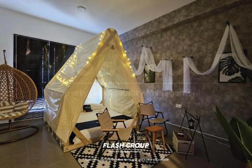 a tent with chairs and a sign that readsriskgroup at Forte Seasons Mossaz Premium Suites Petaling Jaya in Petaling Jaya