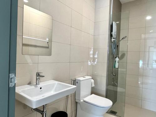 a bathroom with a toilet and a sink and a shower at 3BR-Creamy-Paradigm Residence by Guesthouse-6-8Pax in Johor Bahru