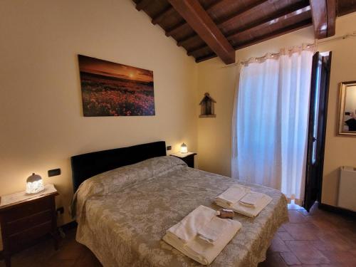 Postel nebo postele na pokoji v ubytování Bio Agriturismo Olivastrella