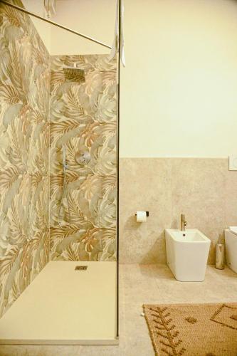 a bathroom with a shower and a sink at Origine Country Farm in Tabiano