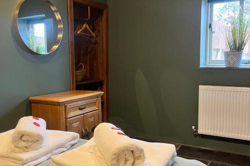 a room with two beds and a mirror at Torworth - 1 Bed Barn - Sleeps 3 - Hot Tub in Torworth