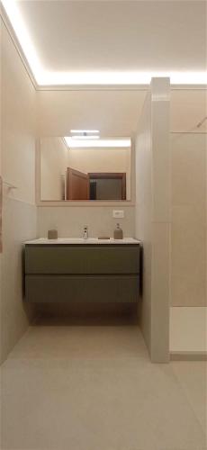 a bathroom with a sink and a mirror at La Solaria in Carmignano