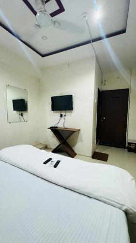 Una televisión o centro de entretenimiento en Hotel Palladium