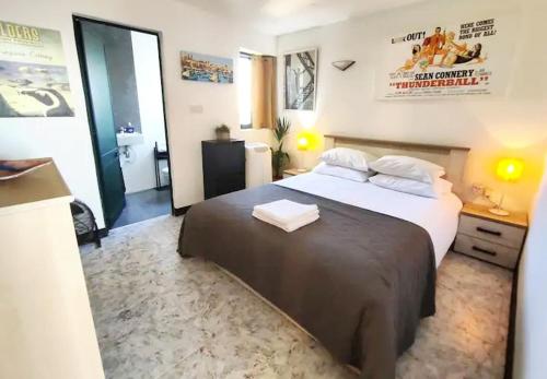 a bedroom with a large bed in a room at Epic 180 degree Sea & 3 Island Views Sun Terrace Penthouse in Qala