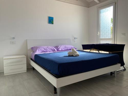 Postel nebo postele na pokoji v ubytování Casa azzurra
