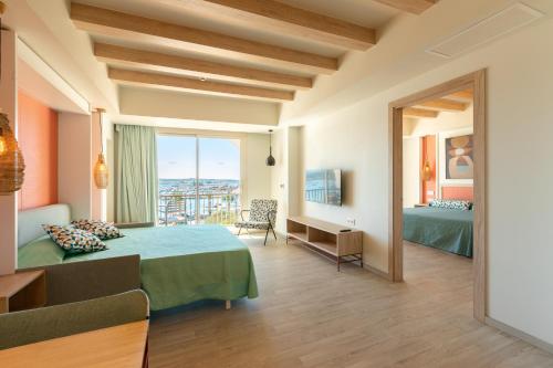 a hotel room with two beds and a balcony at The White Apartments in San Antonio