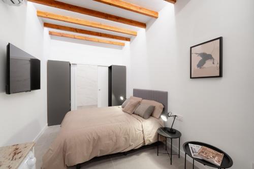 En eller flere senge i et værelse på Alojamiento Casa Liam 2