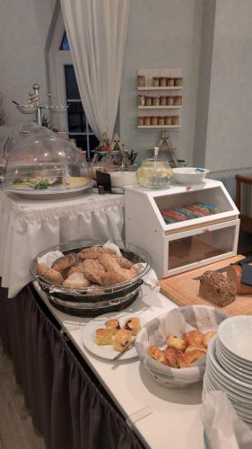 a buffet with many different types of food on a table at Hotel Restaurant Molitor in Bad Homburg vor der Höhe