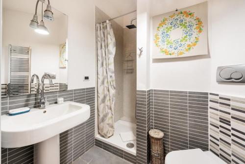 a bathroom with a sink and a shower at Private Condo Terrace & Parking in Rome