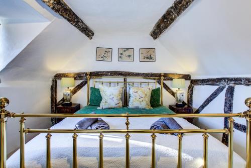 a bedroom with a bed in a attic at Eglantine in Crondall