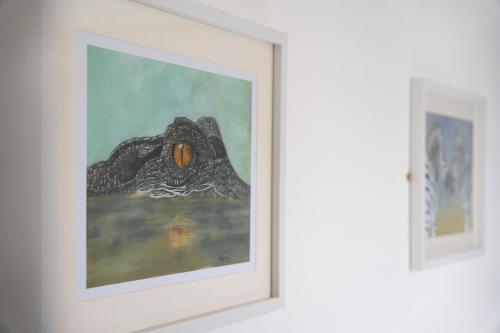 a painting in a white frame on a wall at NEW! 3BR in Traynor Square in Catterick Bridge Station