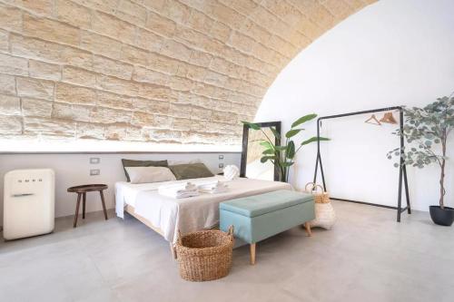 Un pat sau paturi într-o cameră la Pasithéa - Casa della serenità