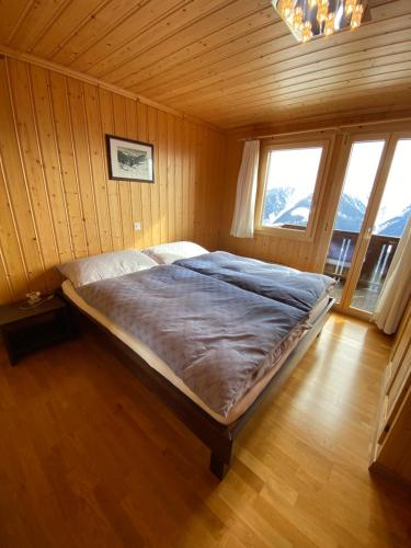 Postel nebo postele na pokoji v ubytování Panoramalodge Aatos