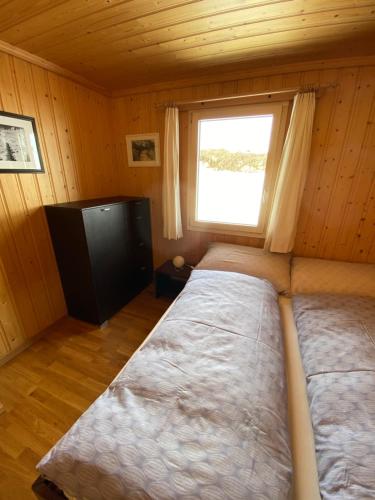 Postel nebo postele na pokoji v ubytování Panoramalodge Aatos