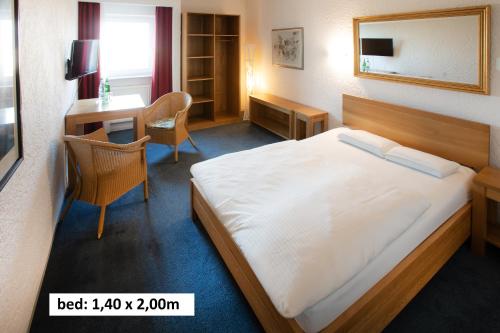 Una cama o camas en una habitación de Elan Hotel