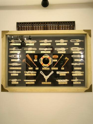 a picture of a display on a wall at HV SENCHO HOMESTAY House Vessel Sencho Home of Nautical Decoration in Temerloh