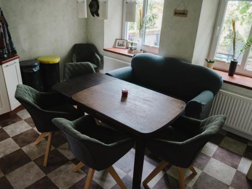 a table and chairs with a cup of coffee on top at Faehrmann-s-Huus-Ditzum in Ditzum