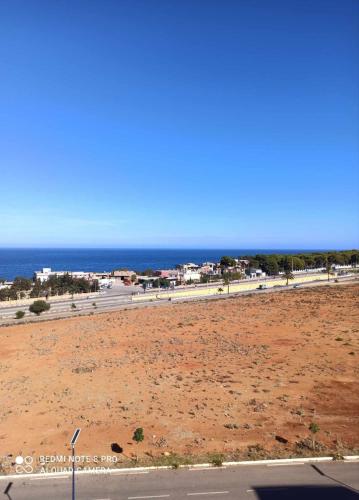 an empty beach with the ocean in the background at Apart F3 in Tipaza, 10 mins from the beach in Tipaza